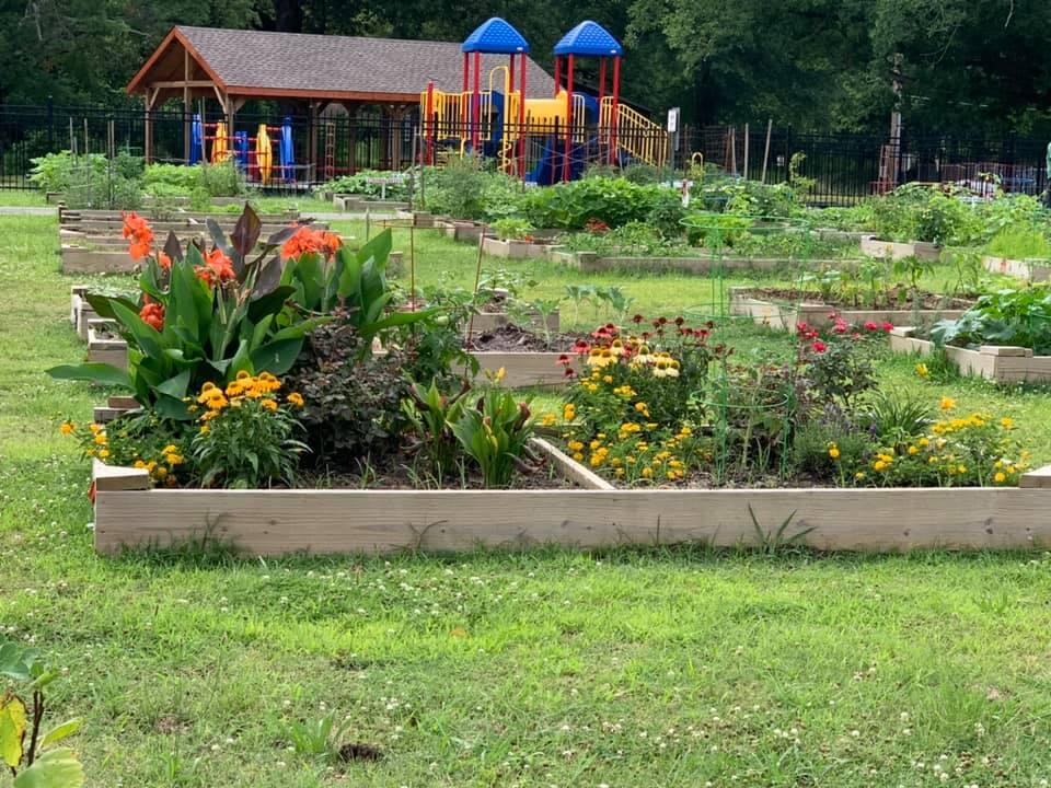 Filled Garden beds in front of children's playground